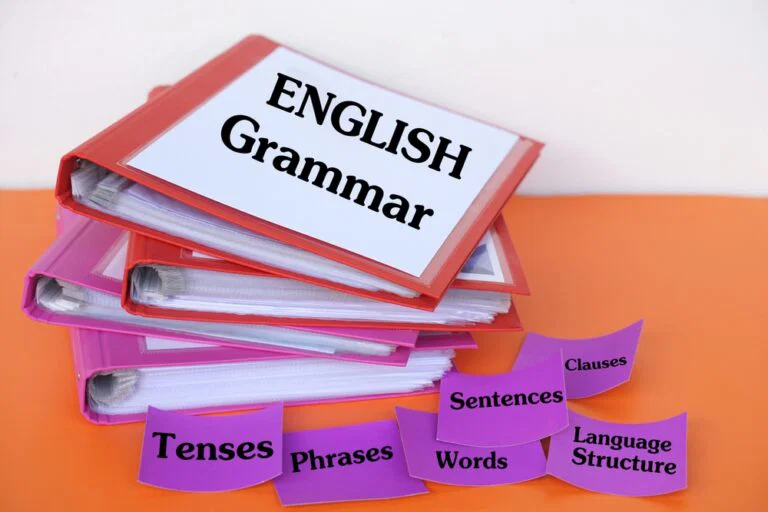 stack,of,colorful,binders,labeled,"english,grammar",with,flashcards,showing